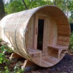 Knotty Red Cedar Barrel Sauna with Porch – 7’x8′